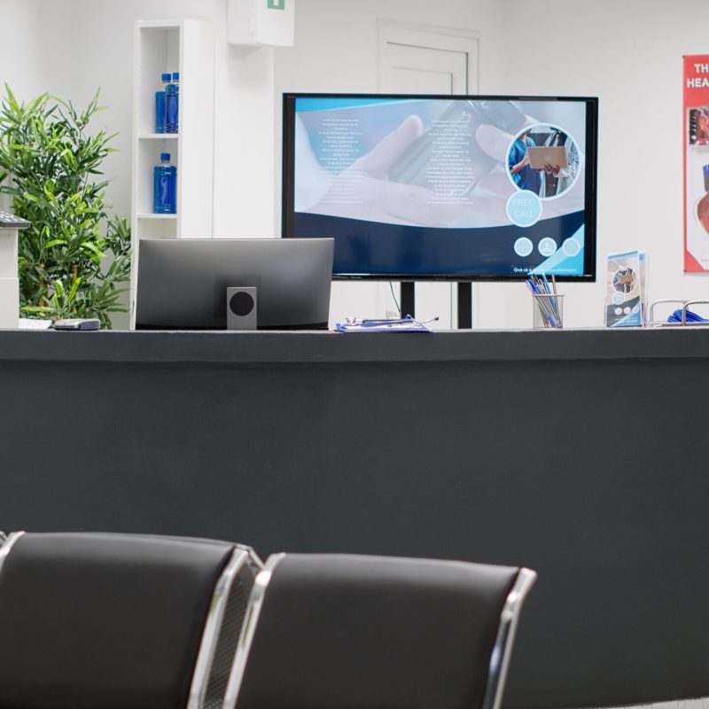 Waiting room lobby with empty reception counter desk to give help and support to patients with consultation appointments. Professional treatment space with checkup visits and clinical exam.